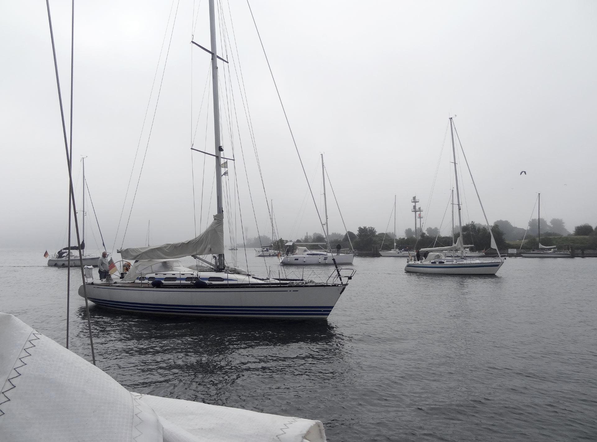 Boats are heading for safe mooring due to arriving fog.