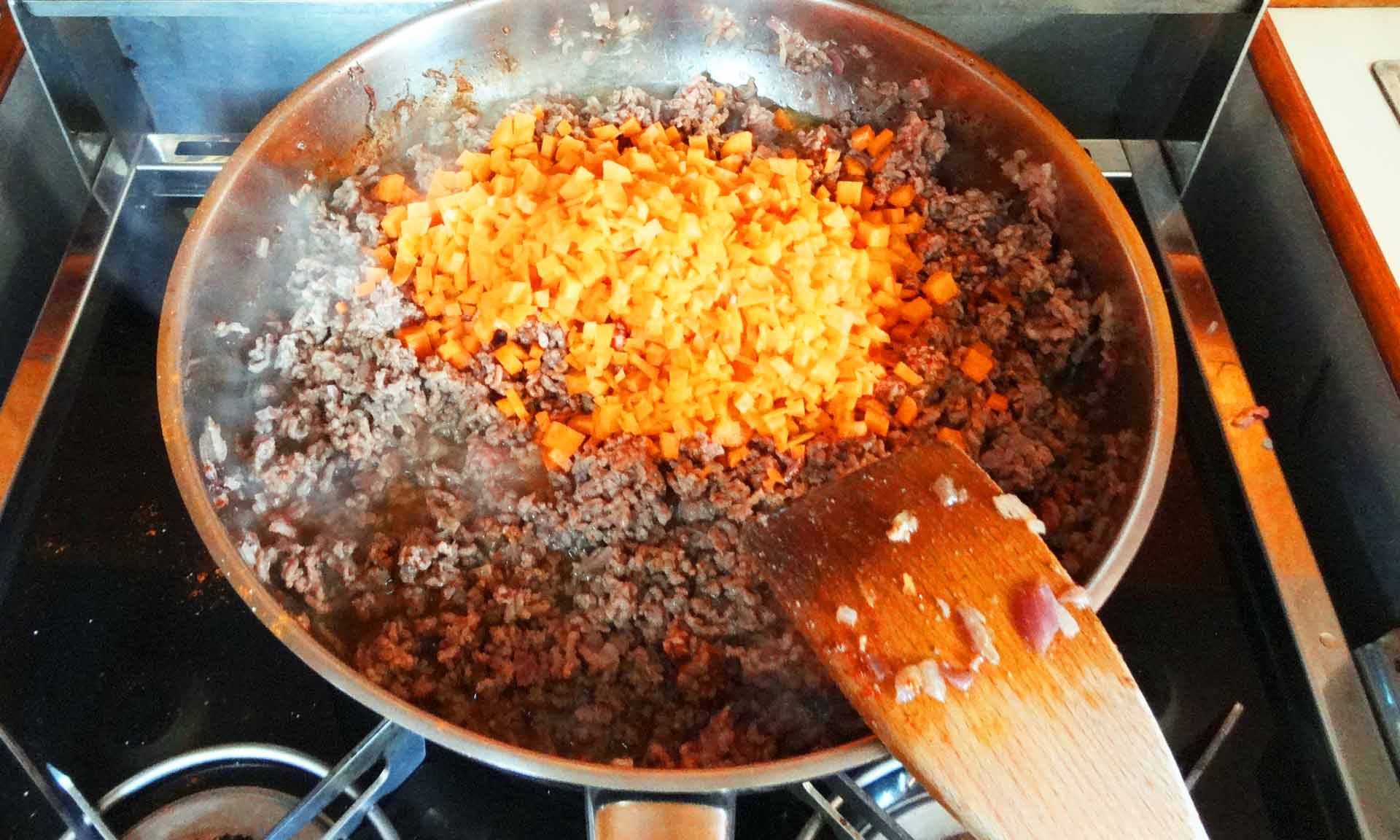 Adding the Carrots to the Minced Meat.